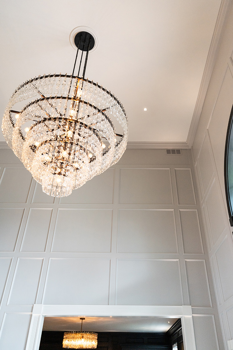 PMV - Project Highlight - Contemporary Lakehouse Entry 3 Freshly painted entryway with large chandelier.
