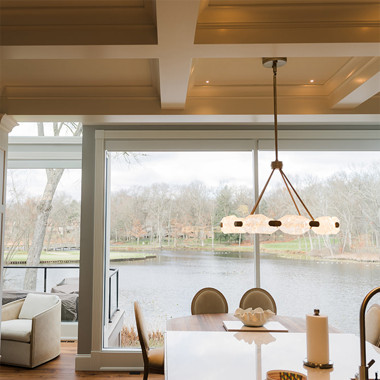 PMV - Project Highlight - Contemporary Lakehouse Kitchen and Dining Room 2 Large widow in freshly painted kitchen looking out onto a lake.
