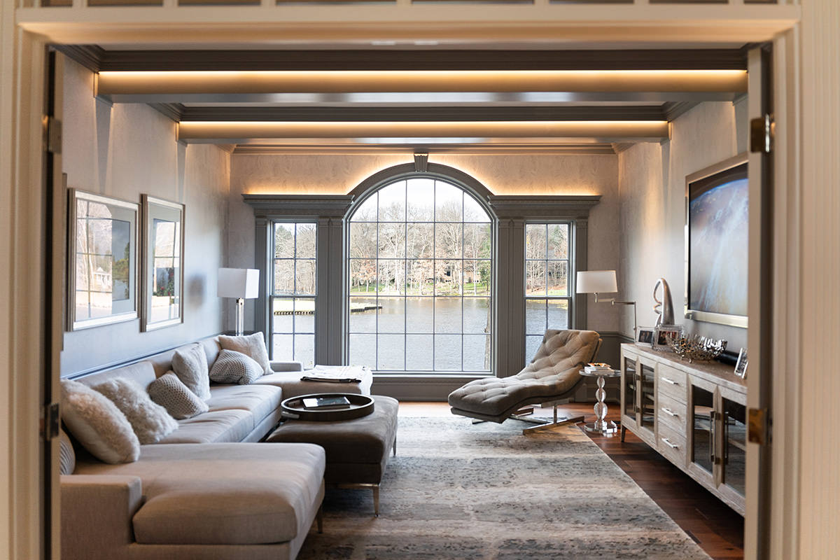 PMV - Project Highlight - Contemporary Lakehouse Living Areas Entertainment 1 Sitting room with large picture windows looking out over a lake.