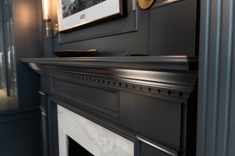 PMV - Project Highlight - Contemporary Lakehouse Living Areas Library 3 Close up of flawless paint job on a fireplace.